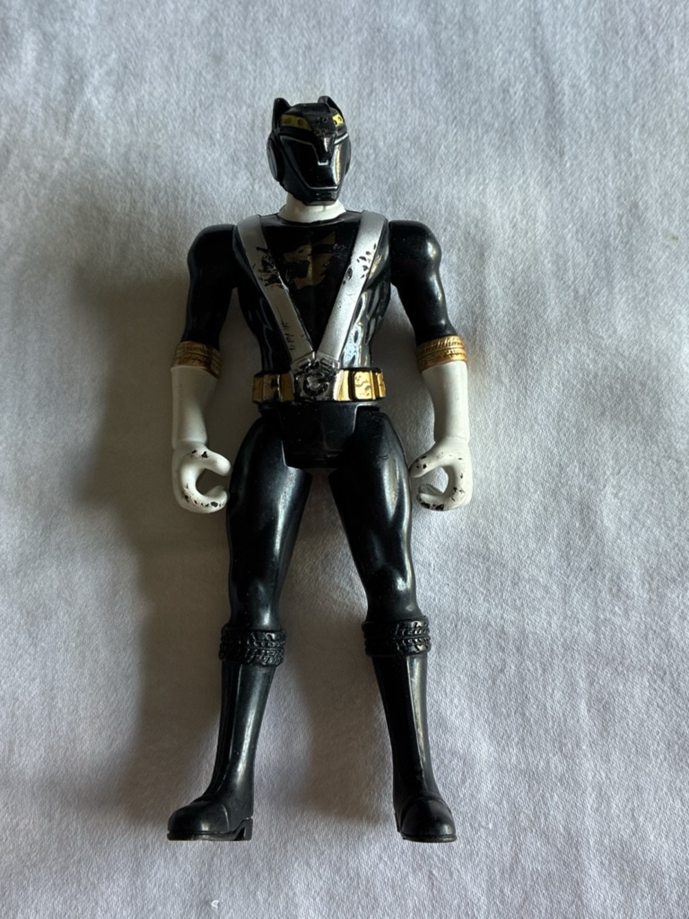 Black Power Ranger Action Figure with White and Gold Accents